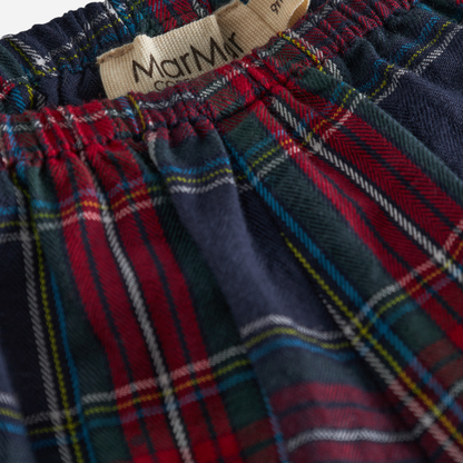 Sold at Bombon shop, designed by MarMar Copenhagen. Red and navy plaid baby bloomers with elastic waistband, pair perfectly with the embroidered collar bodysuit and matching red cardigan.