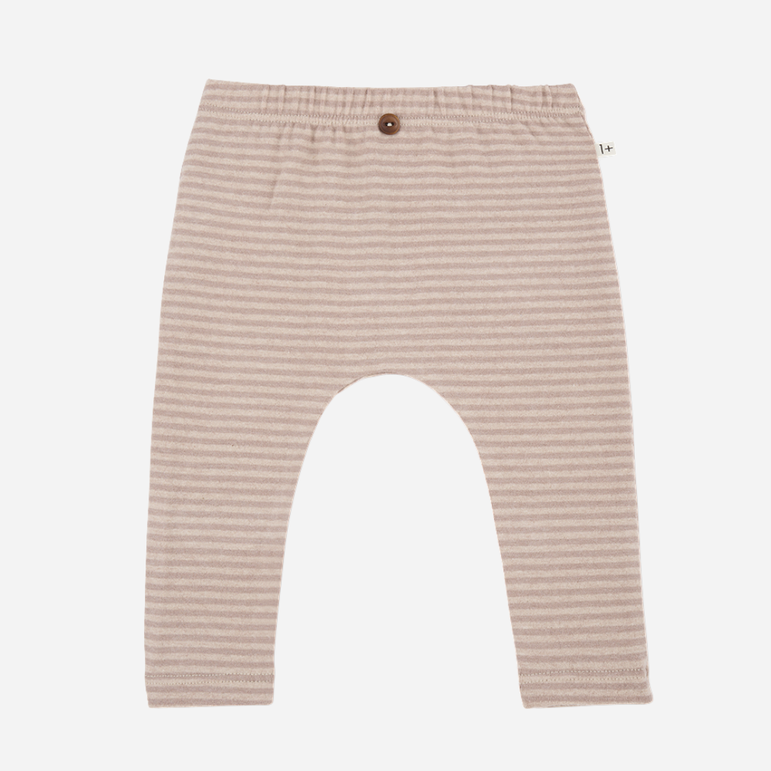 Sold at Bombon shop, designed by 1+ in the family — nude striped baby leggings with elastic waist and single button detail.