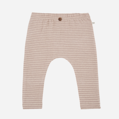 Sold at Bombon shop, designed by 1+ in the family — nude striped baby leggings with elastic waist and single button detail.
