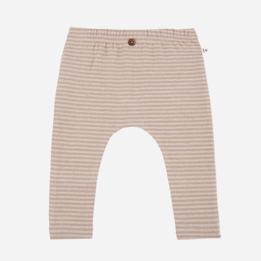 Sold at Bombon shop, designed by 1+ in the family — nude striped baby leggings with elastic waist and single button detail.