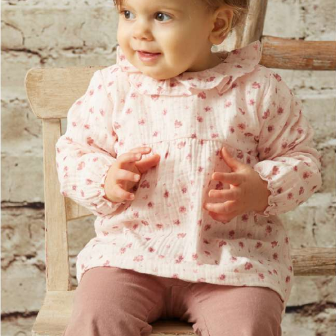 Sold at Bombon shop, designed by Tiny Soul — blush pink floral blouse with gathered waist, puff sleeves, and scalloped collar. model