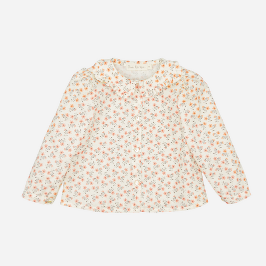 Sold at Bombon shop, designed by Fina Ejerique, floral viyella blouse with ruffled collar, pairs perfectly with the beige textured skirt and pink vest. front