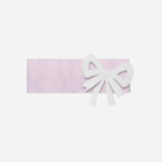 Sold at Bombon and designed by Gensami, a soft pink cotton baby headband featuring a large white satin bow on the side.