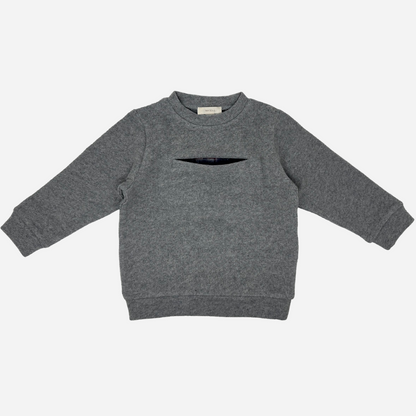 Sold at Bombon shop, designed by Tiny Soul — grey baby sweater with front slit pocket and hidden plaid lining. front