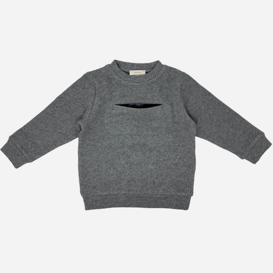Sold at Bombon shop, designed by Tiny Soul — grey baby sweater with front slit pocket and hidden plaid lining. front