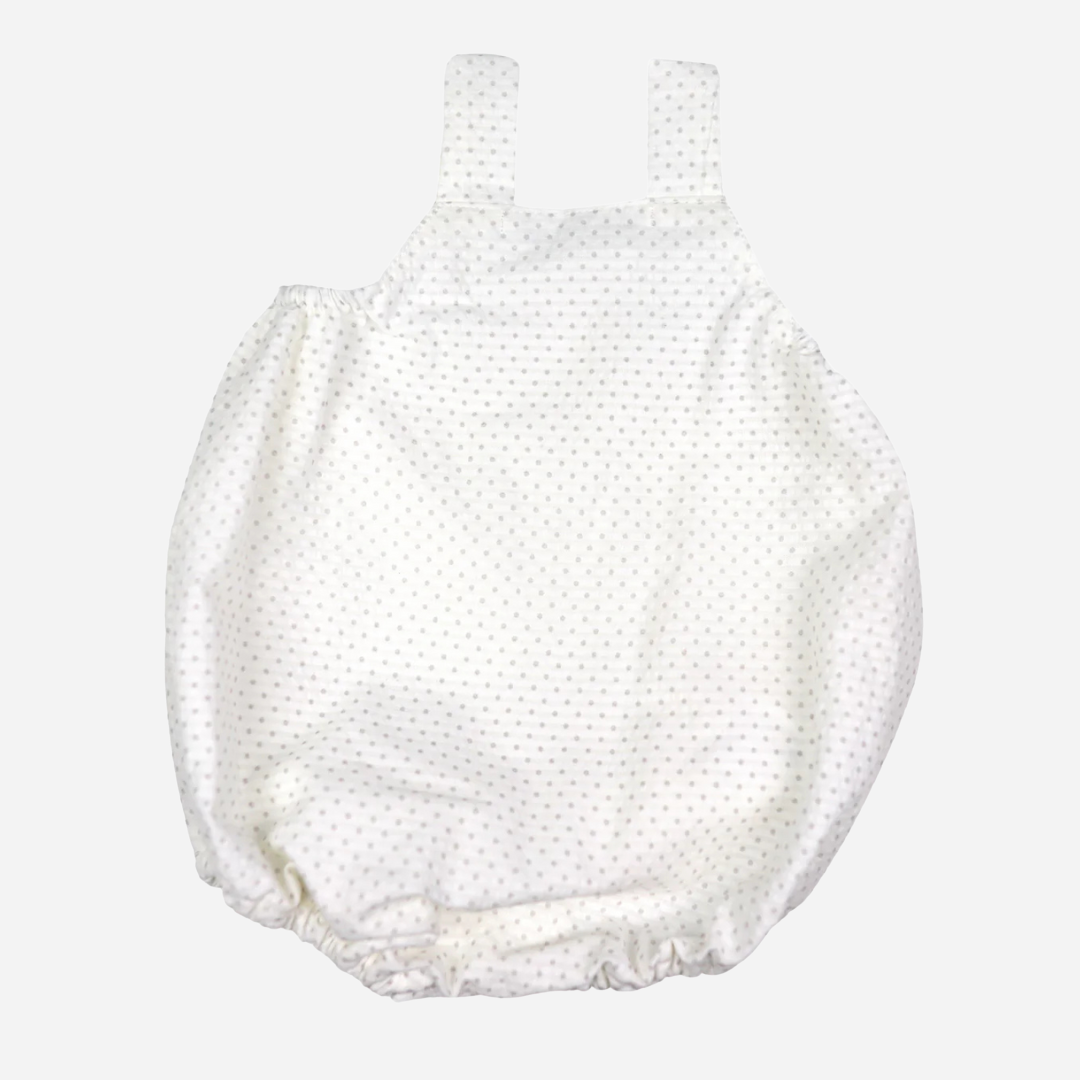 Sold at Bombon shop, designed by Al Agua Patos brand, this white polka dot baby romper for baby boys is perfect for spring and summer. back