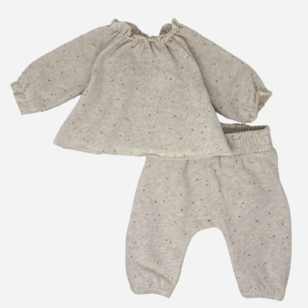 Sold at Bombon shop, designed by Tiny Soul — beige speckled knit baby blouse with gathered neckline and long puffed sleeves. as a set