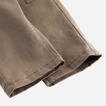 Sold at Bombon shop, designed by MarMar Copenhagen — taupe 100% cotton baby pants with front pockets and elastic waistband, pairs perfectly with the striped knit cardigan