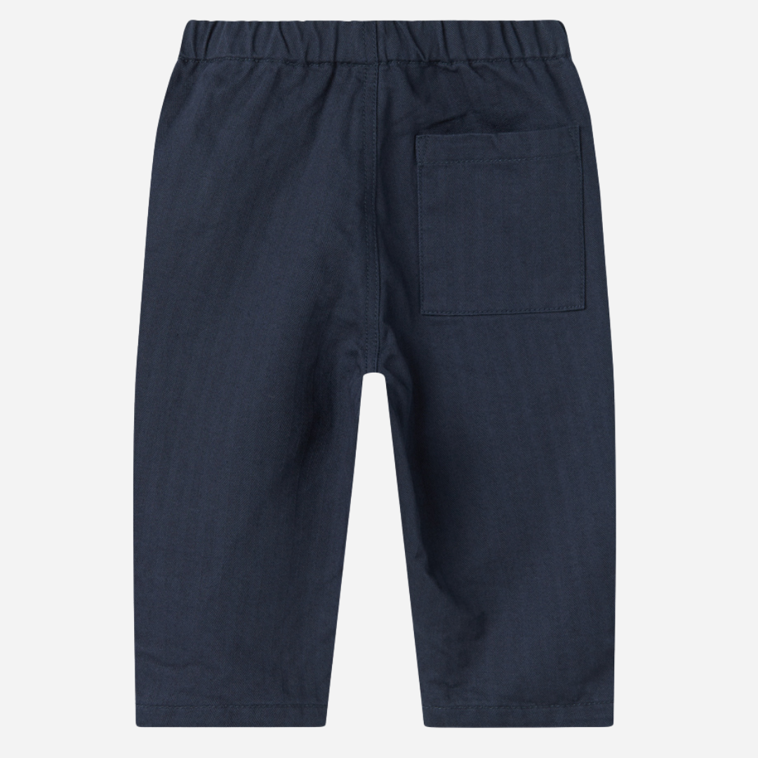 Sold at Bombon shop, designed by MarMar Copenhagen. Navy cotton pants with drawstring waist, pair perfectly with the matching red check shirt.