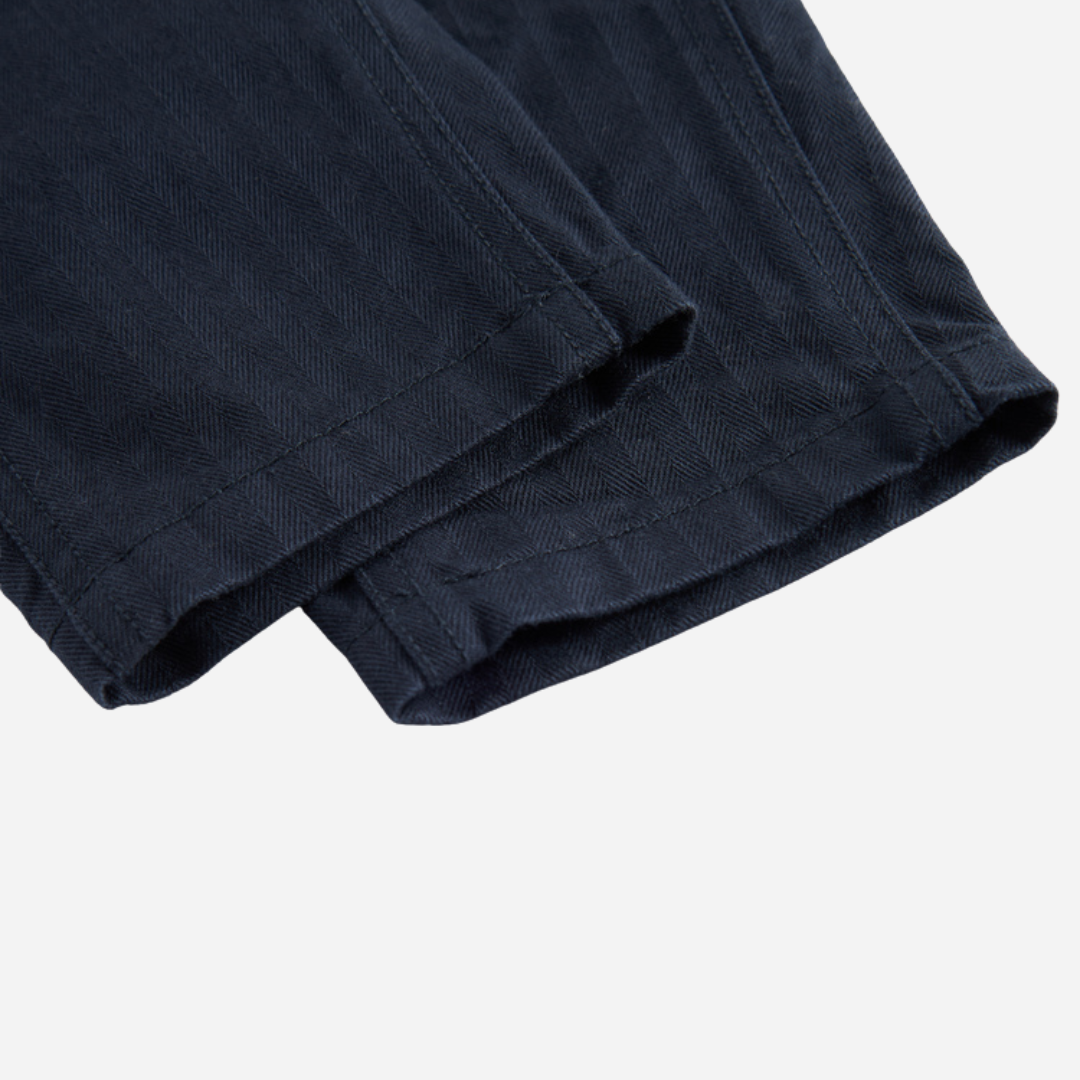 Sold at Bombon shop, designed by MarMar Copenhagen. Navy cotton pants with drawstring waist, pair perfectly with the matching red check shirt.