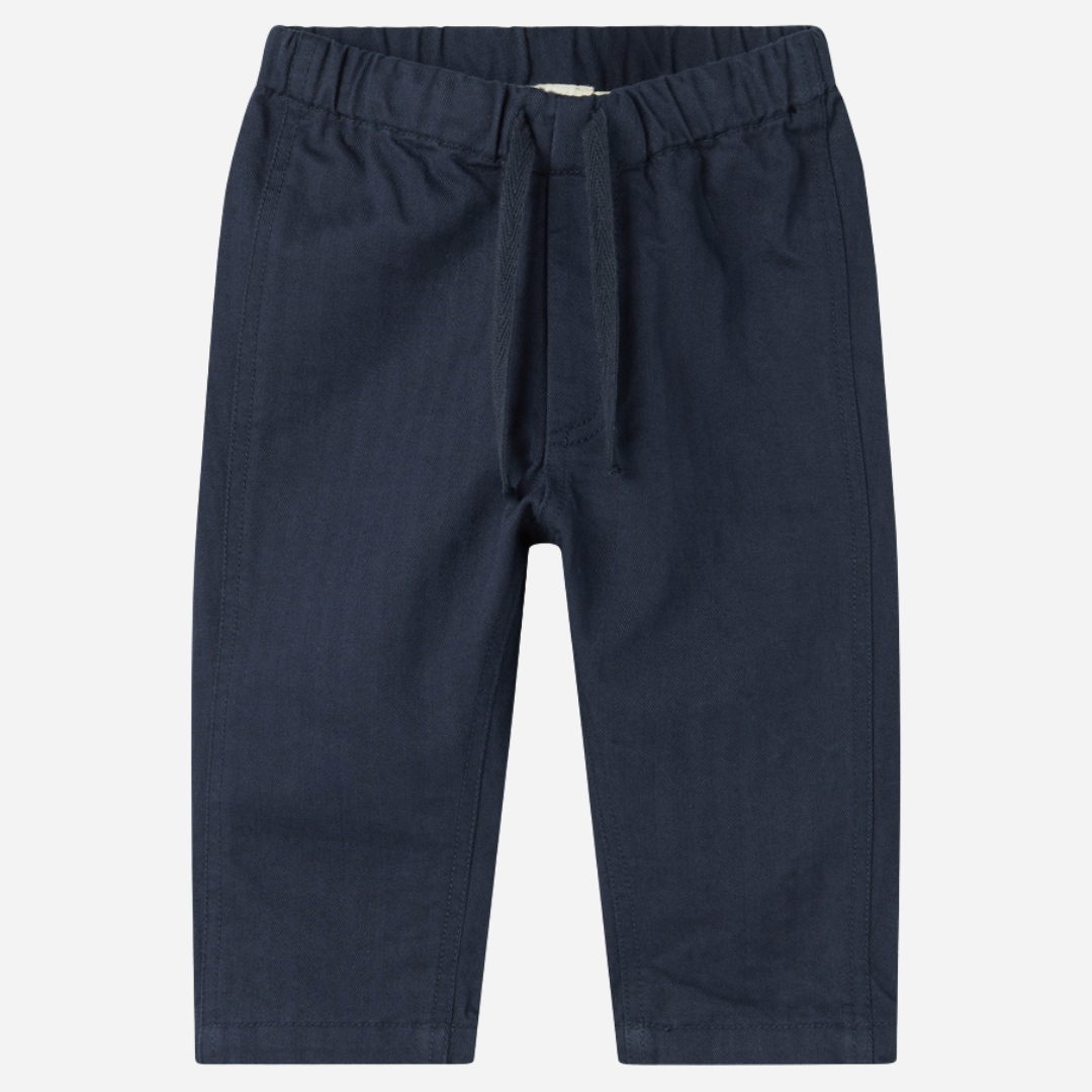 Sold at Bombon shop, designed by MarMar Copenhagen. Navy cotton pants with drawstring waist, pair perfectly with the matching red check shirt.