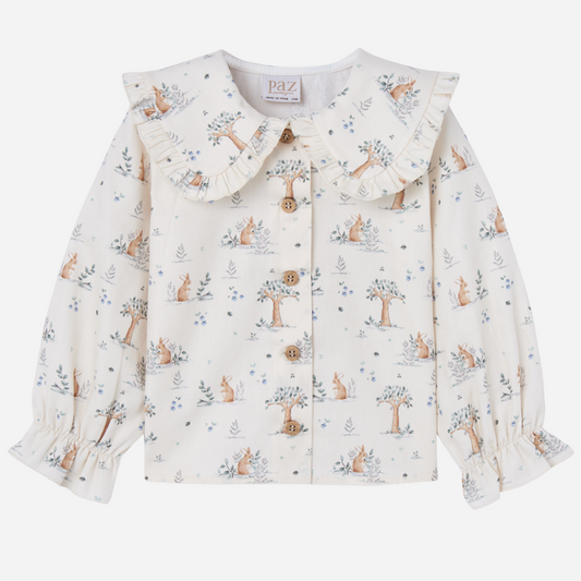 Sold at Bombon shop, designed by Paz Rodriguez. Cream bunny-print blouse with wooden buttons and ruffled collar, perfect paired with the Pompon Shorts and Cardigan in brown.