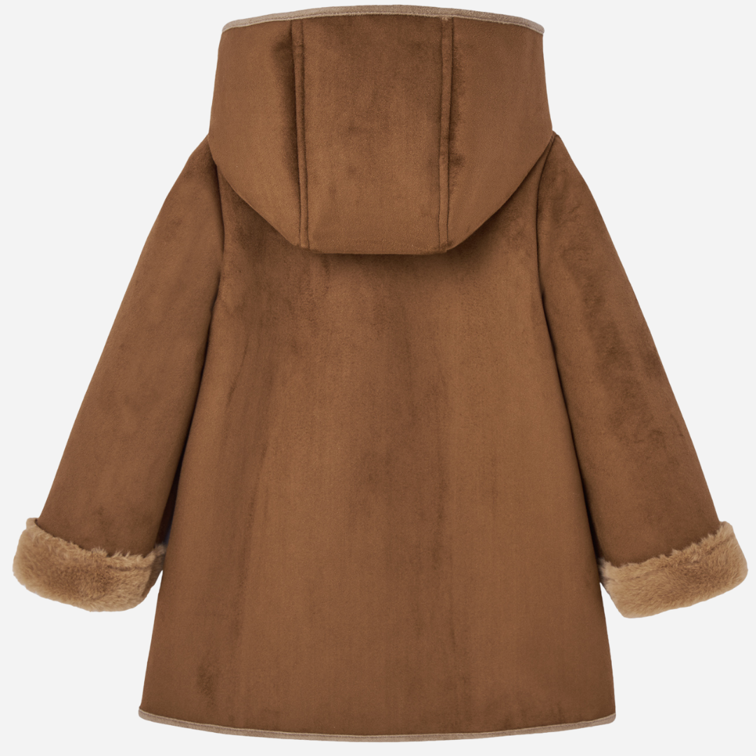 Sold at Bombon shop, designed by Paz Rodriguez. Brown hooded coat for children with faux fur lining, button closure, and trimmed front pockets.