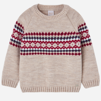 Sold at Bombon shop, designed by Paz Rodriguez. Beige knit sweater with red, navy, and ivory Nordic pattern across chest and sleeves.