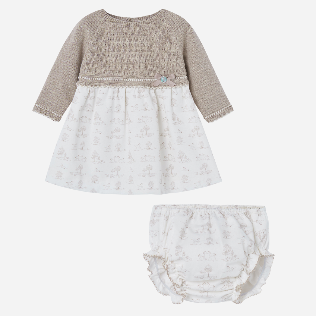 Sold at Bombon shop, designed by Paz Rodriguez, beige knit baby dress with printed pony skirt and matching bloomers.