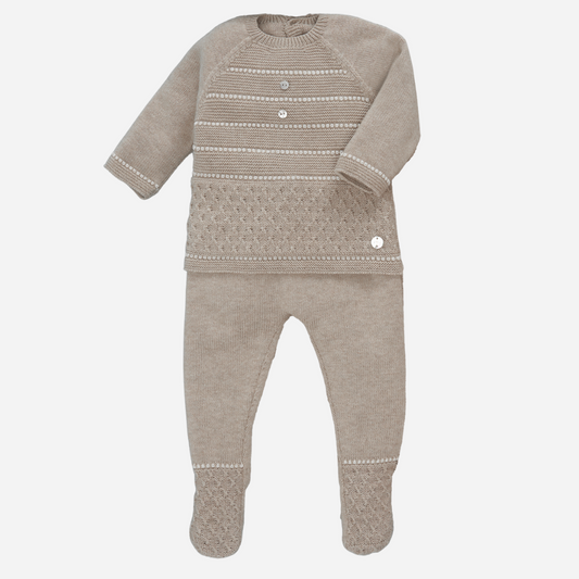 Sold at Bombon shop, designed by Paz Rodriguez, beige knit baby set with patterned sweater and matching footed pants.
