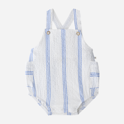 Sold at Bombon Shop, designed by 1+ in the family, ultramarine striped baby romper with adjustable straps and lightweight cotton fabric.