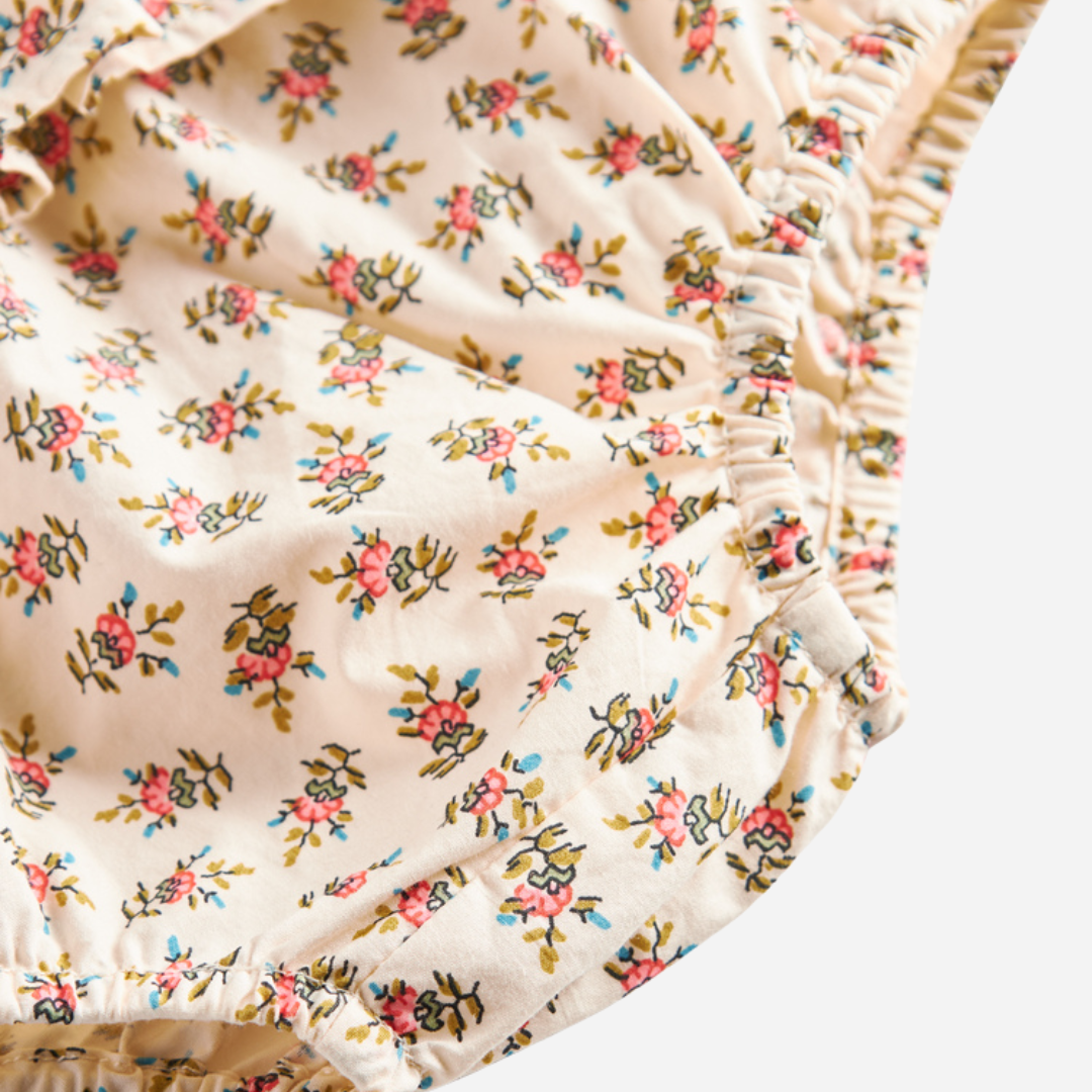 Sold at Bombon shop, designed by MarMar Copenhagen — floral cotton baby bloomers with ruffled waist, pairs perfectly with matching floral blouse.