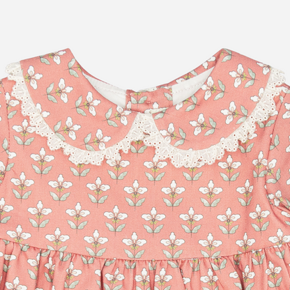 Sold at Bombon shop, designed by Fina Ejerique, a coral-pink floral baby dress with lace-trim collar and long sleeves. zoom