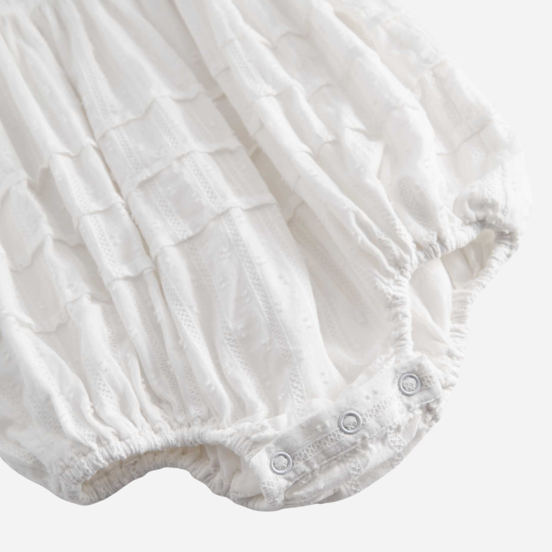 Sold at Bombon shop, designed by Mar Mar Copenhagen, Ritona baby bodysuit in White with puff sleeves