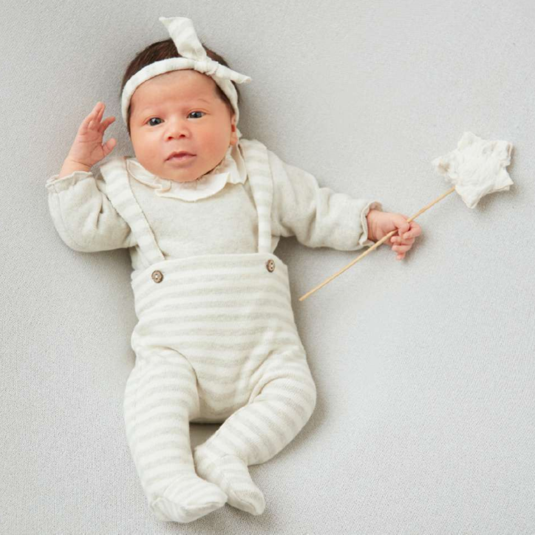 Sold at Bombon shop, designed by Tiny Soul — baby footed overall in grey and white stripes with buttoned shoulder straps and attached feet. model