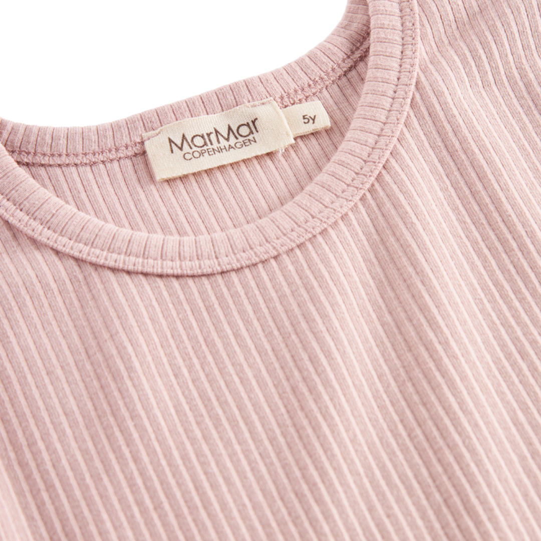 Sold at Bombon shop, designed by MarMar Copenhagen — blush pink ribbed organic cotton long-sleeve baby top, part of a matching set.