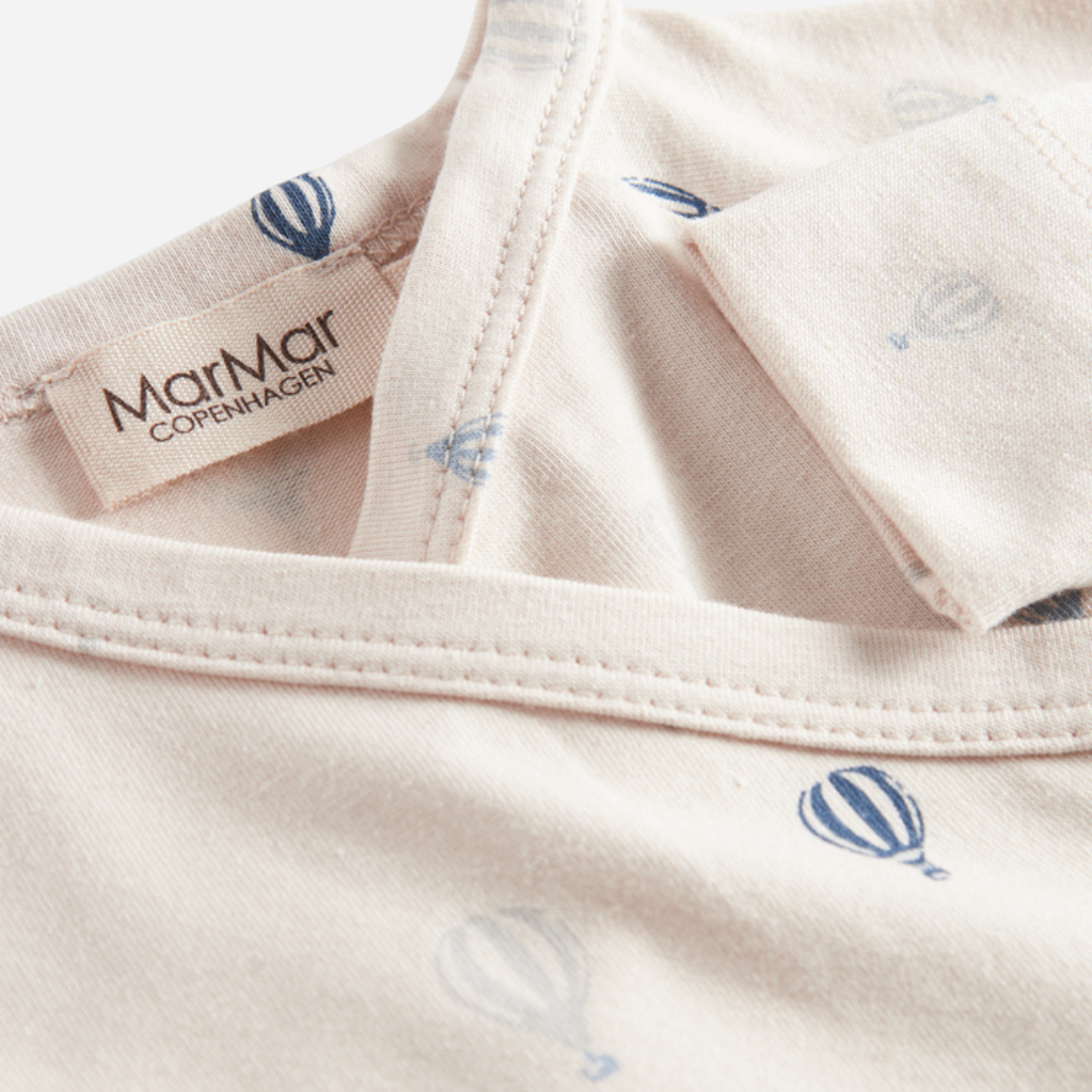 Sold at Bombon shop, designed by MarMar Copenhagen. Cream baby hat with blue air balloon print, pairs perfectly with the matching air balloon footie and blanket.