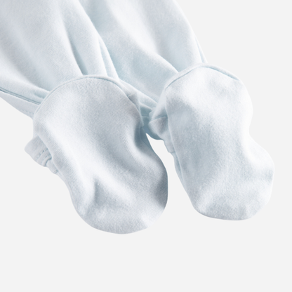 Sold at Bombon shop, designed by MarMar Copenhagen — powder blue organic cotton footed baby onesie with side tie closure.