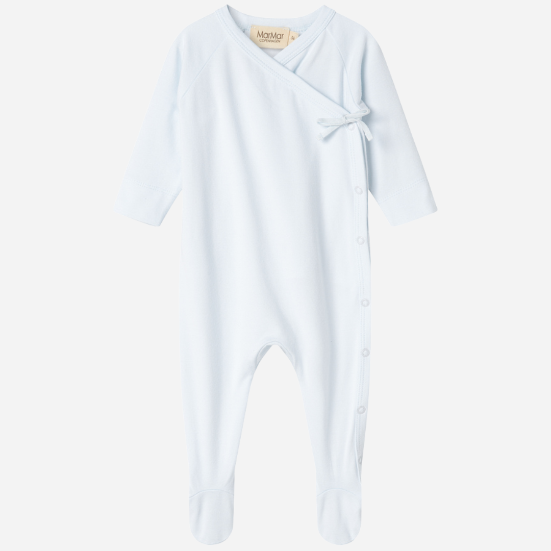 Sold at Bombon shop, designed by MarMar Copenhagen — powder blue organic cotton footed baby onesie with side tie closure.