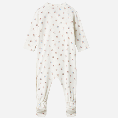 Sold at Bombon shop, designed by MarMar Copenhagen — white organic cotton baby onesie with floral print and side-tie closure, part of a matching set.