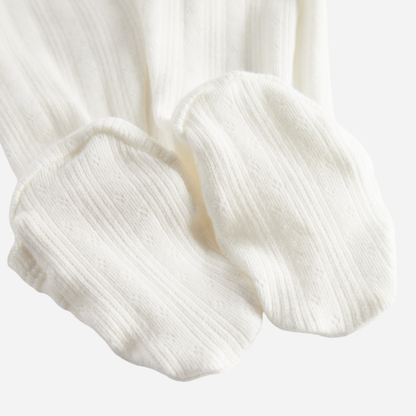 Sold at Bombon shop, designed by MarMar Copenhagen. Cream white ribbed baby wrap footie with side tie, pairs perfectly with the matching hat and blanket.