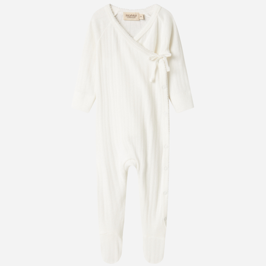 Sold at Bombon shop, designed by MarMar Copenhagen. Cream white ribbed baby wrap footie with side tie, pairs perfectly with the matching hat and blanket.