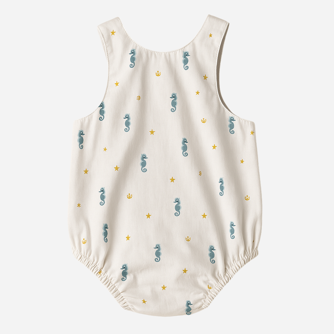 sold at Bombon shop, designed by Paloma de la O brand, this sea horse print baby romper for baby boys is ideal for spring and summer. back view