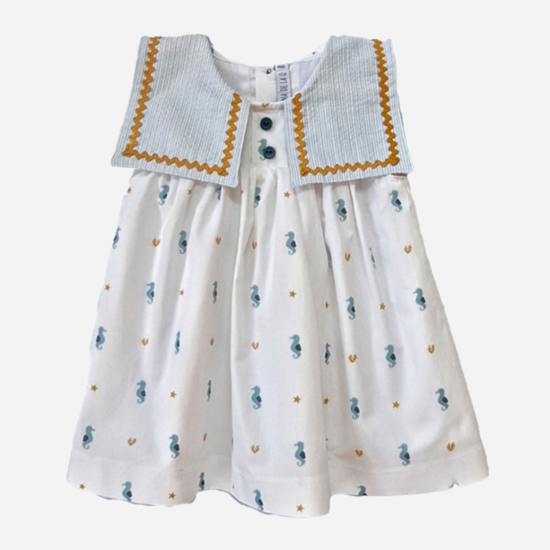 Sold at Bombon shop, designed by Paloma de la O brand, this beautiful sea horse print dress for baby girls and toddlers is ideal for spring and summer. 