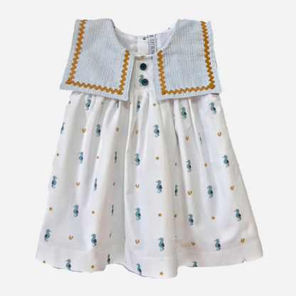 Sold at Bombon shop, designed by Paloma de la O brand, this beautiful sea horse print dress for baby girls and toddlers is ideal for spring and summer. 