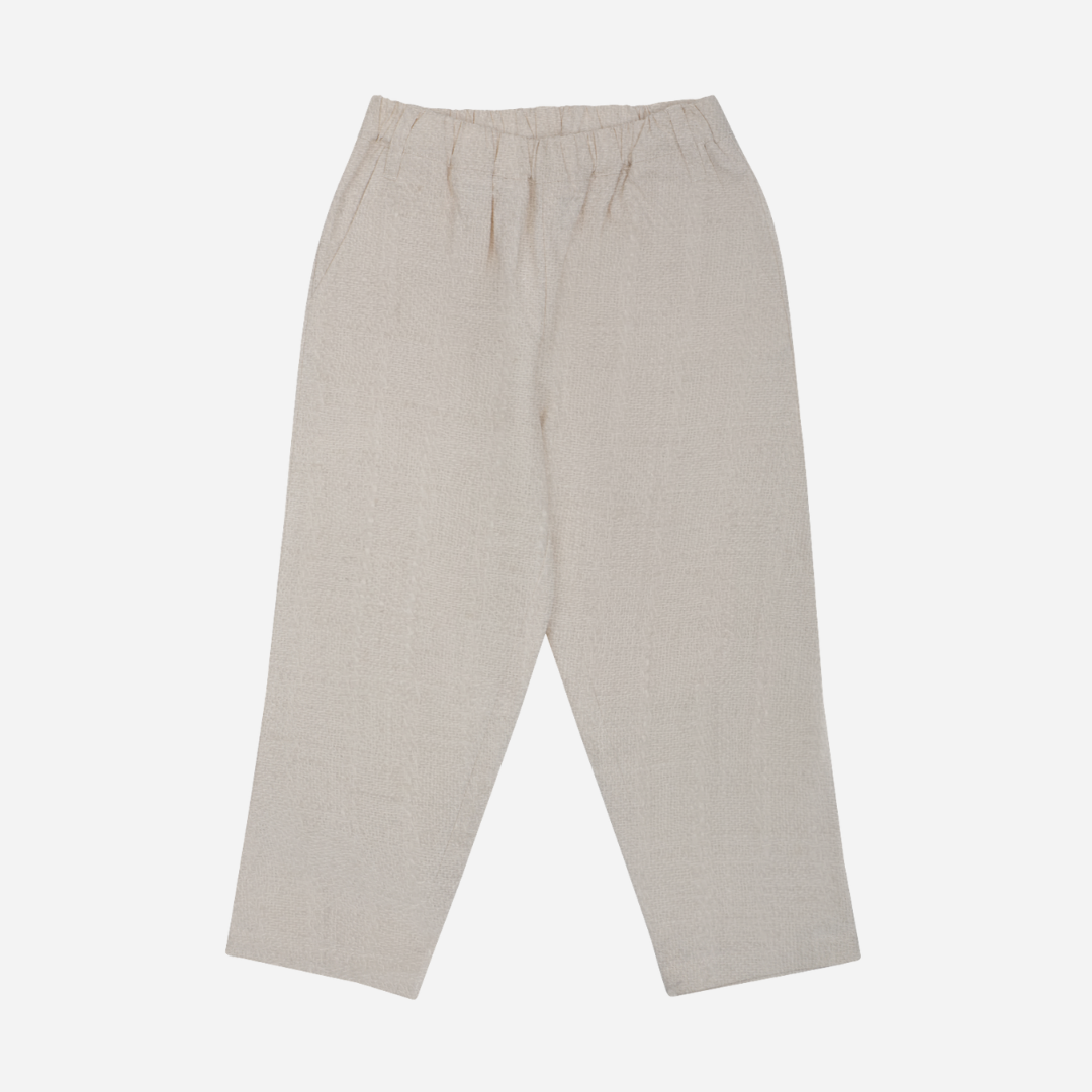 Sold at Bombon shop, designed by Donsje from Amsterdam, these baby and toddler trousers in warm white go with everything and are unisex. Perfect for pre fall all the way through winter.  front view