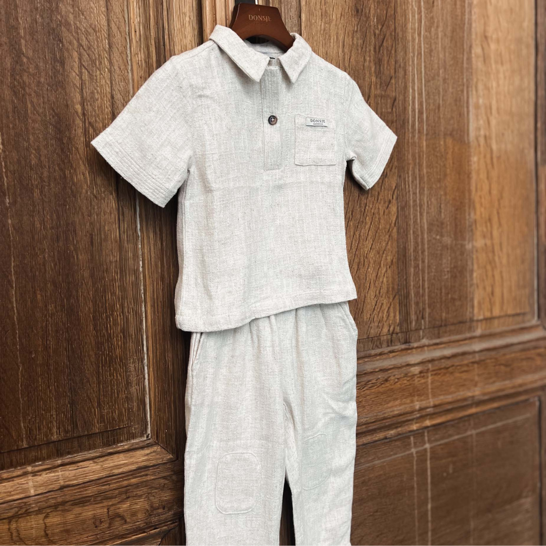 Sold at Bombon shop, designed by Donsje from Amsterdam, these baby and toddler trousers in warm white go with everything and are unisex. Perfect for pre fall all the way through winter.  hanger view