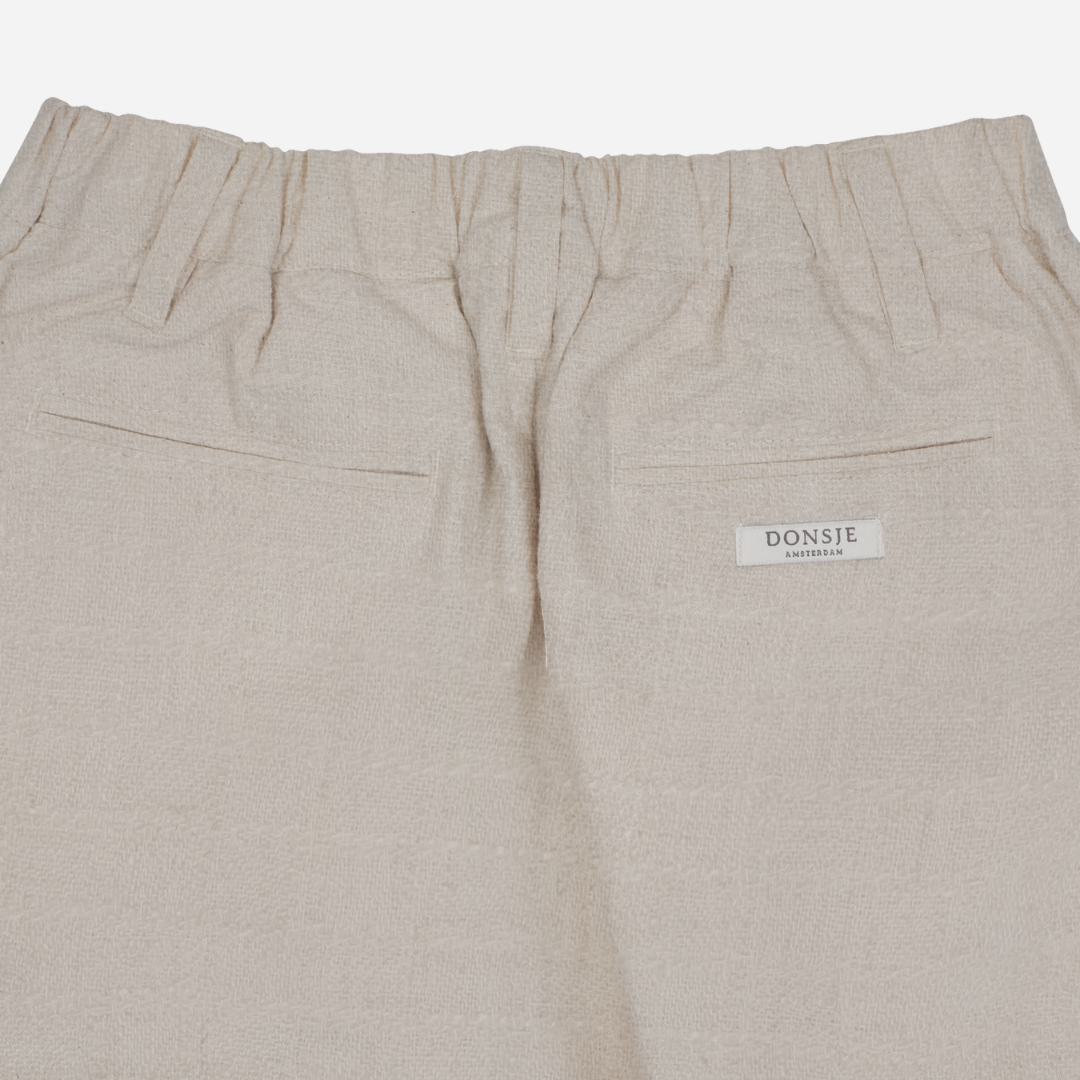 Sold at Bombon shop, designed by Donsje from Amsterdam, these baby and toddler trousers in warm white go with everything and are unisex. Perfect for pre fall all the way through winter.  top back view