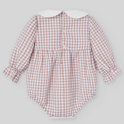 Sold at Bombon shop, designed by Paz Rodriguez, beige gingham baby romper with white collar and long sleeves.