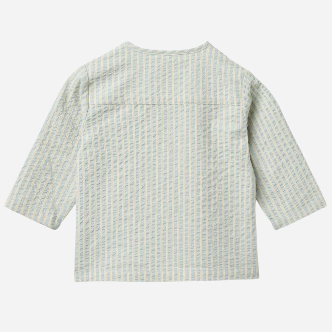 Sold at Bombon Shop, designed by Wheat, summer sky stripe organic cotton baby long sleeve shirt with soft blue vertical stripes.