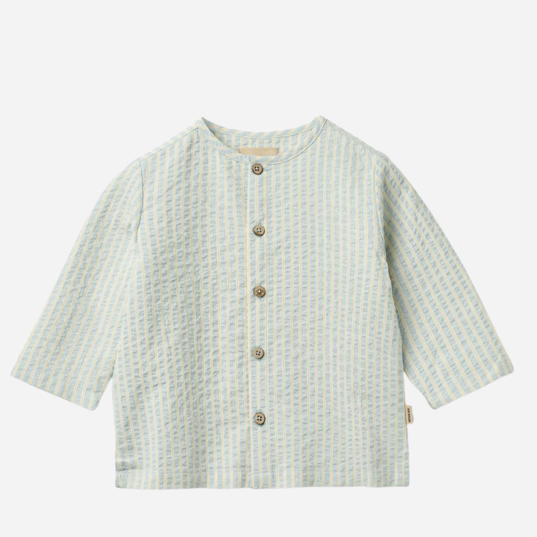 Sold at Bombon Shop, designed by Wheat, summer sky stripe organic cotton baby long sleeve shirt with soft blue vertical stripes.