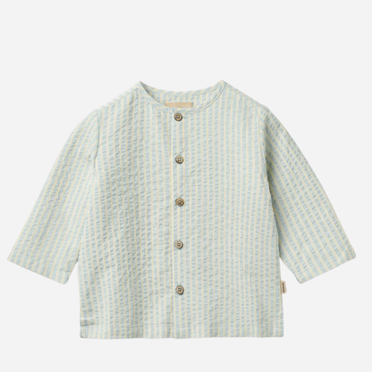 Sold at Bombon Shop, designed by Wheat, summer sky stripe organic cotton baby long sleeve shirt with soft blue vertical stripes.