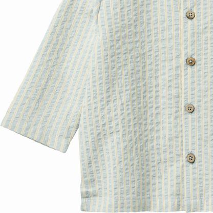 Sold at Bombon Shop, designed by Wheat, summer sky stripe organic cotton baby long sleeve shirt with soft blue vertical stripes.