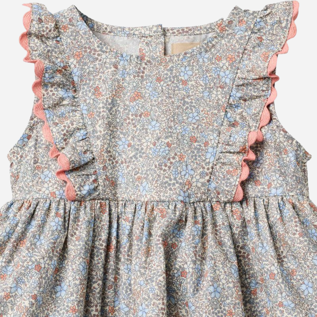 Sold at Bombon Shop, designed by Wheat, air blue flowers organic cotton baby dress with matching bloomers in soft blue floral print