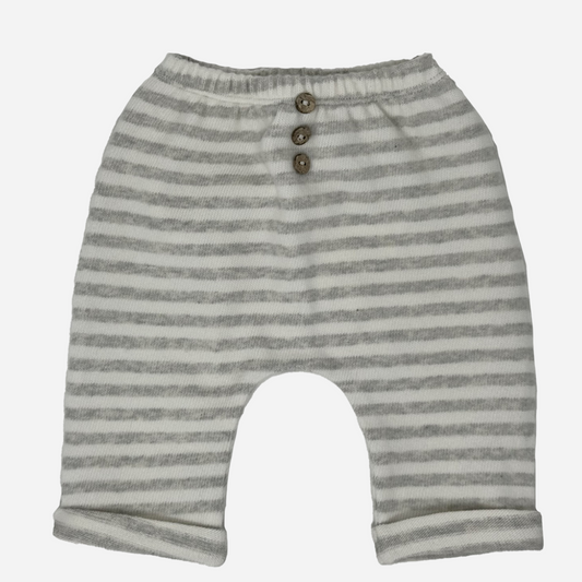 Sold at Bombon shop, designed by Tiny Soul — baby pants in grey and white stripes with elastic waistband, button accents, and rolled cuffs. front