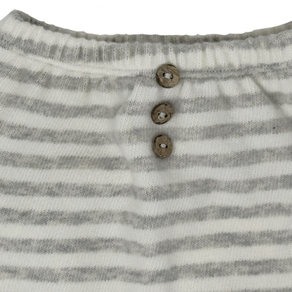 Sold at Bombon shop, designed by Tiny Soul — baby pants in grey and white stripes with elastic waistband, button accents, and rolled cuffs. detail