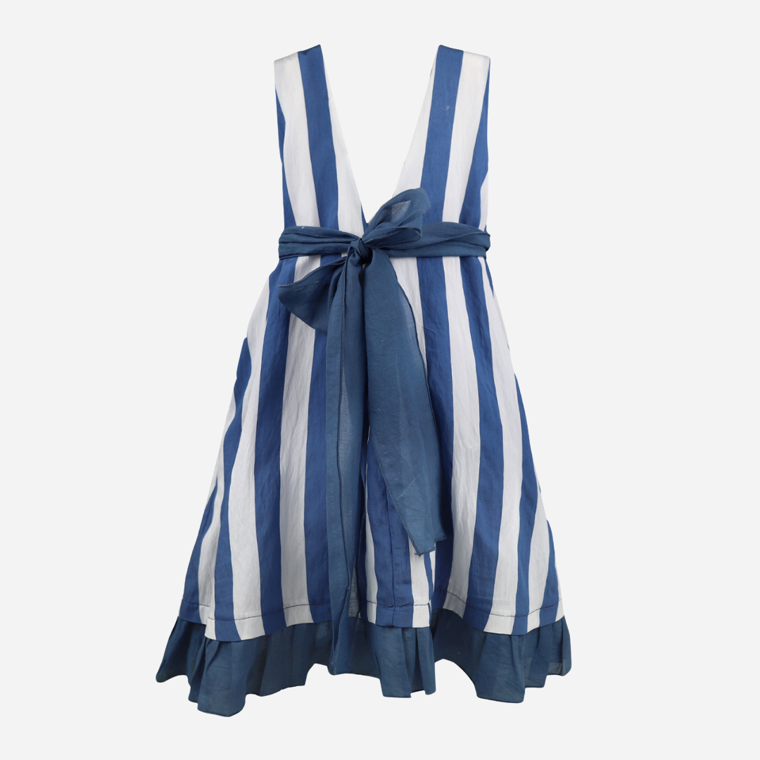 sold at bombon shop, designed by al agua patos brand, this blue and white striped dress for girls is perfect for spring and summer. back view