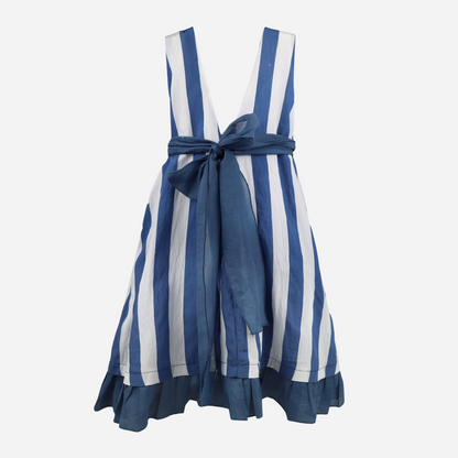 sold at bombon shop, designed by al agua patos brand, this blue and white striped dress for girls is perfect for spring and summer. back view