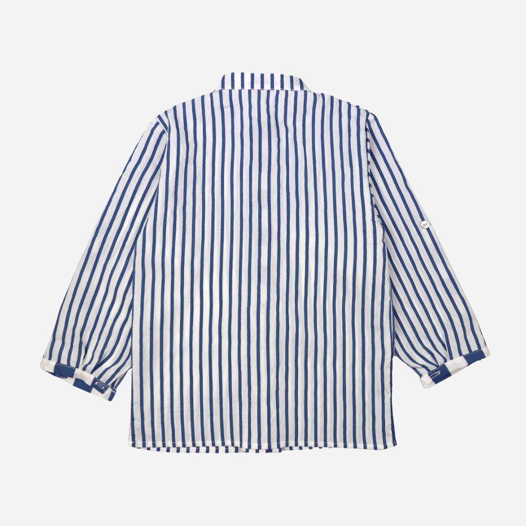 Sold at Bombon shop, designed by Al Agua Patos brand, this blue and white striped shirt for baby boys and toddlers perfect for spring and summer. back view
