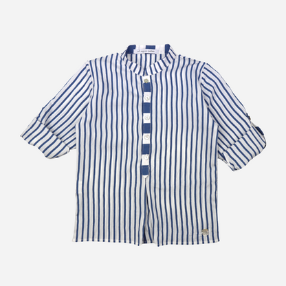 Sold at Bombon shop, designed by Al Agua Patos brand, this blue and white striped shirt for baby boys and toddlers perfect for spring and summer. rolled sleeves